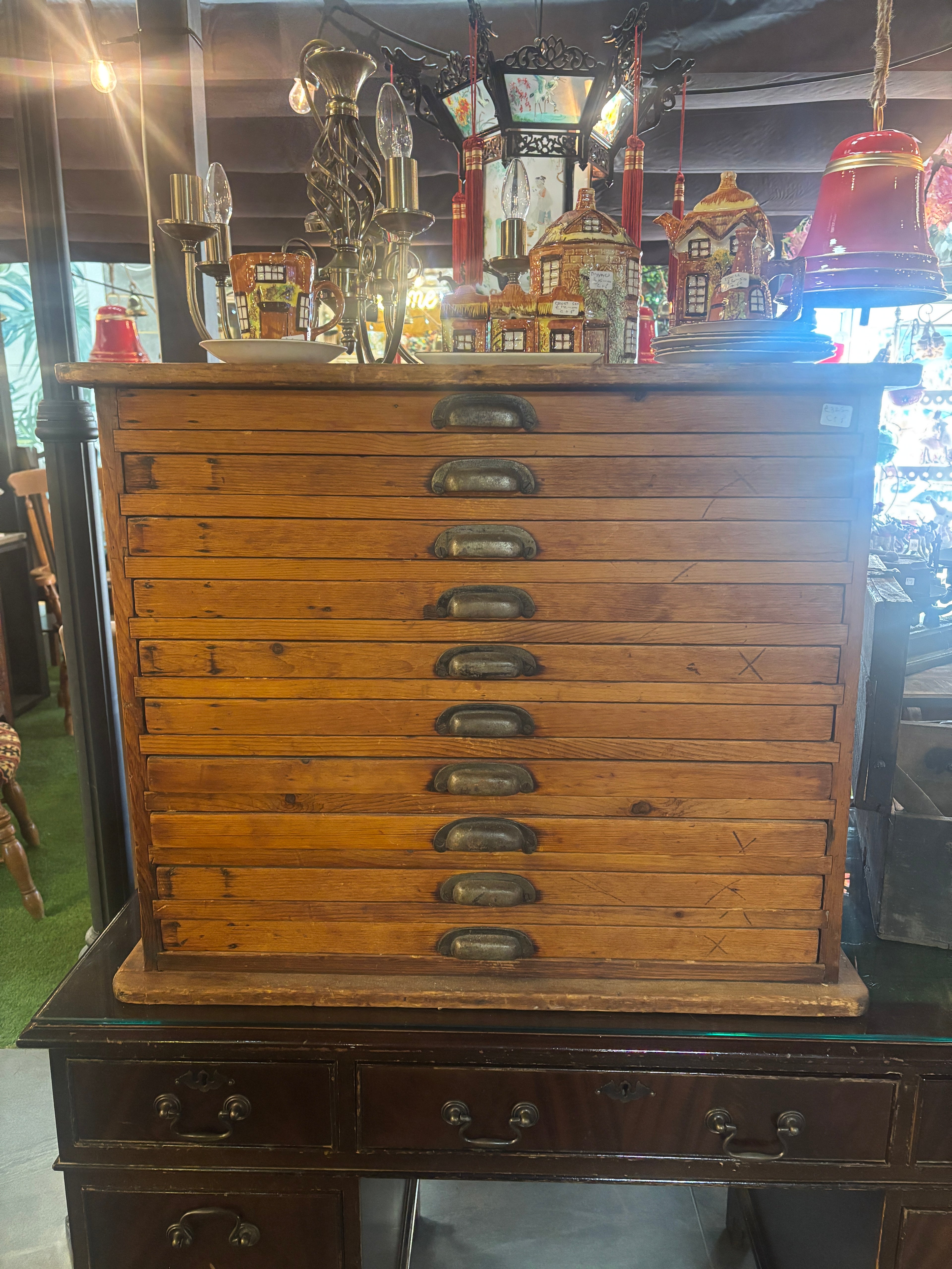 Wooden chest with metal handles on a reflective surface