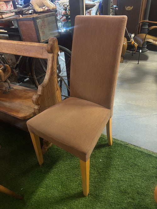 Brown chair on a green grass-like surface