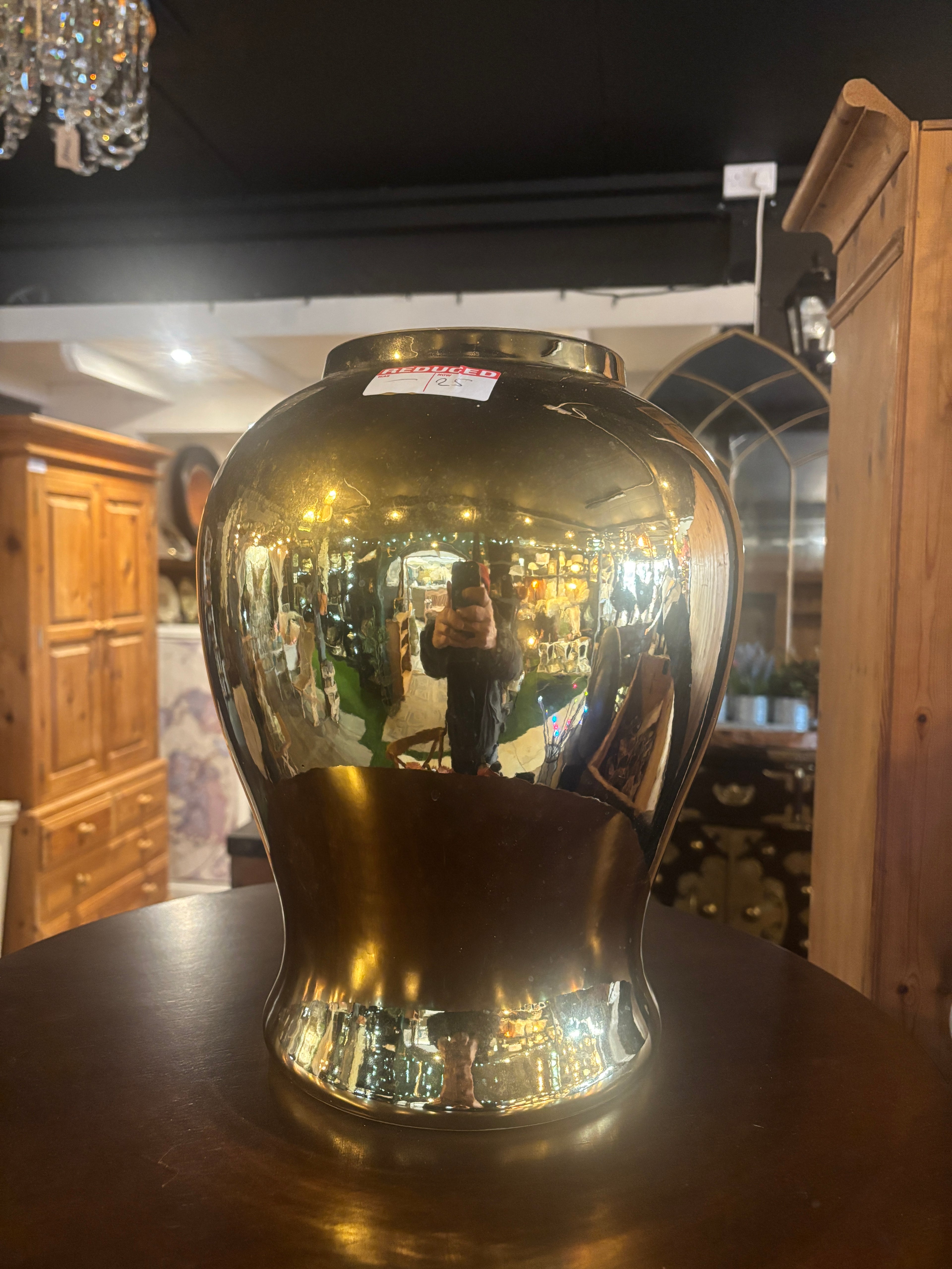 Gold Vase on wooden surface