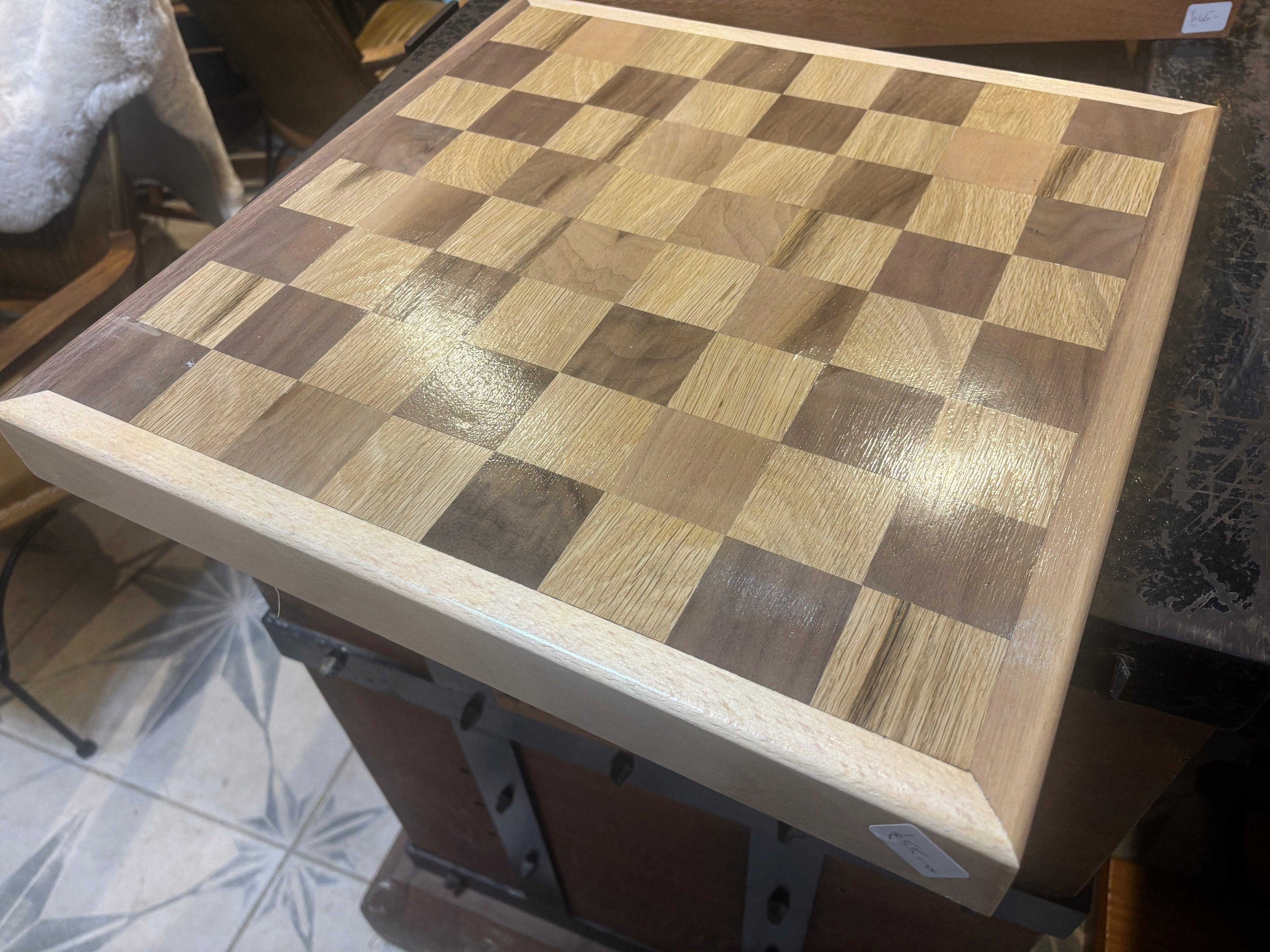 Wooden checkered table top with a checkered pattern on a surface.