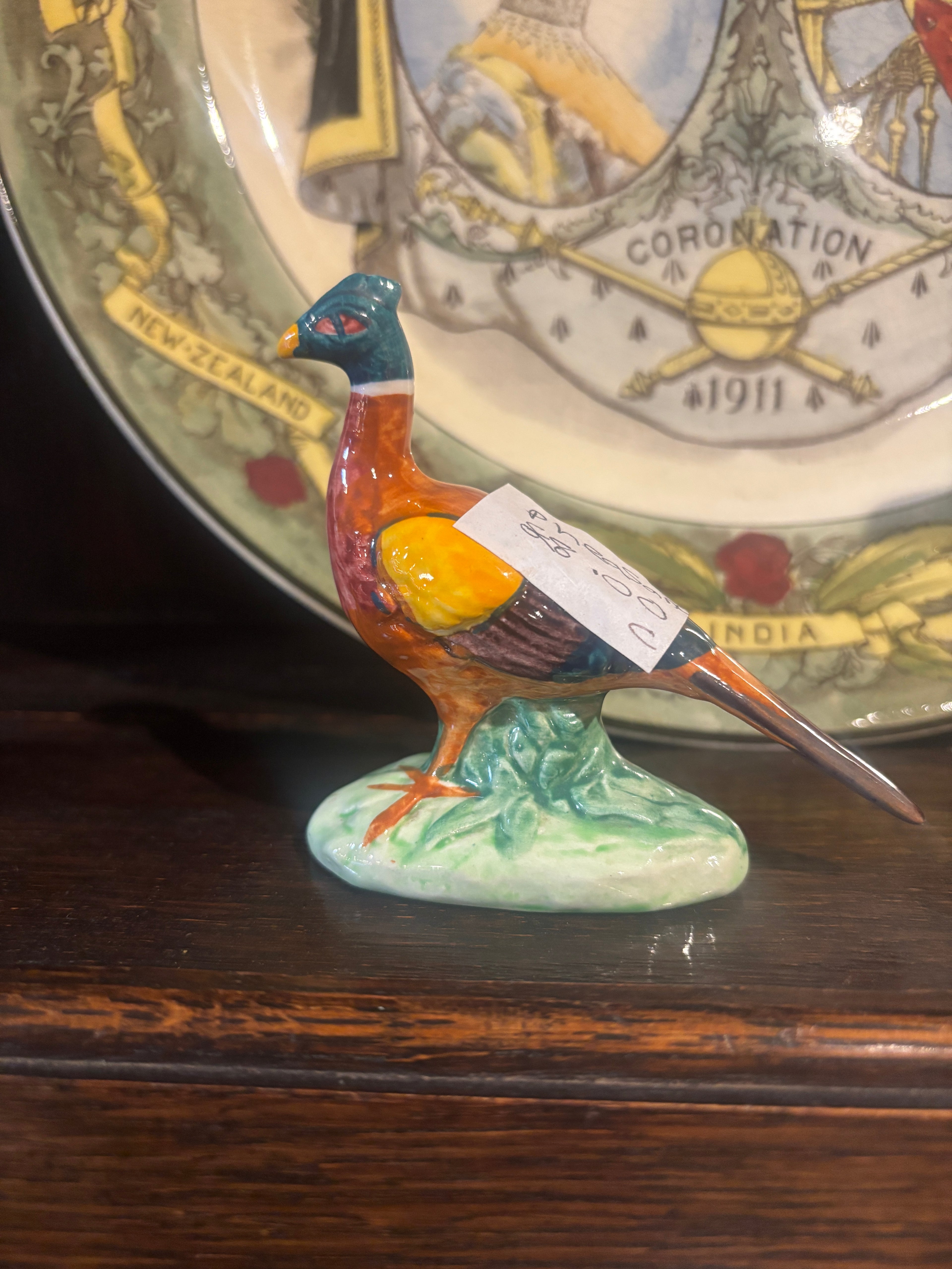 Small Vintage Ceramic Pheasant Ornament on a wooden surface