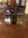 Vintage binoculars on a wooden surface