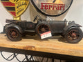 Vintage Model Car on a wooden surface