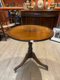 Vintage Wooden Round Table on a wooden floor in a  room 